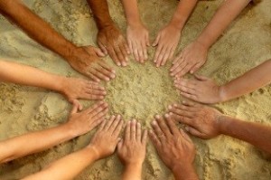 Hands In Circle In Sand