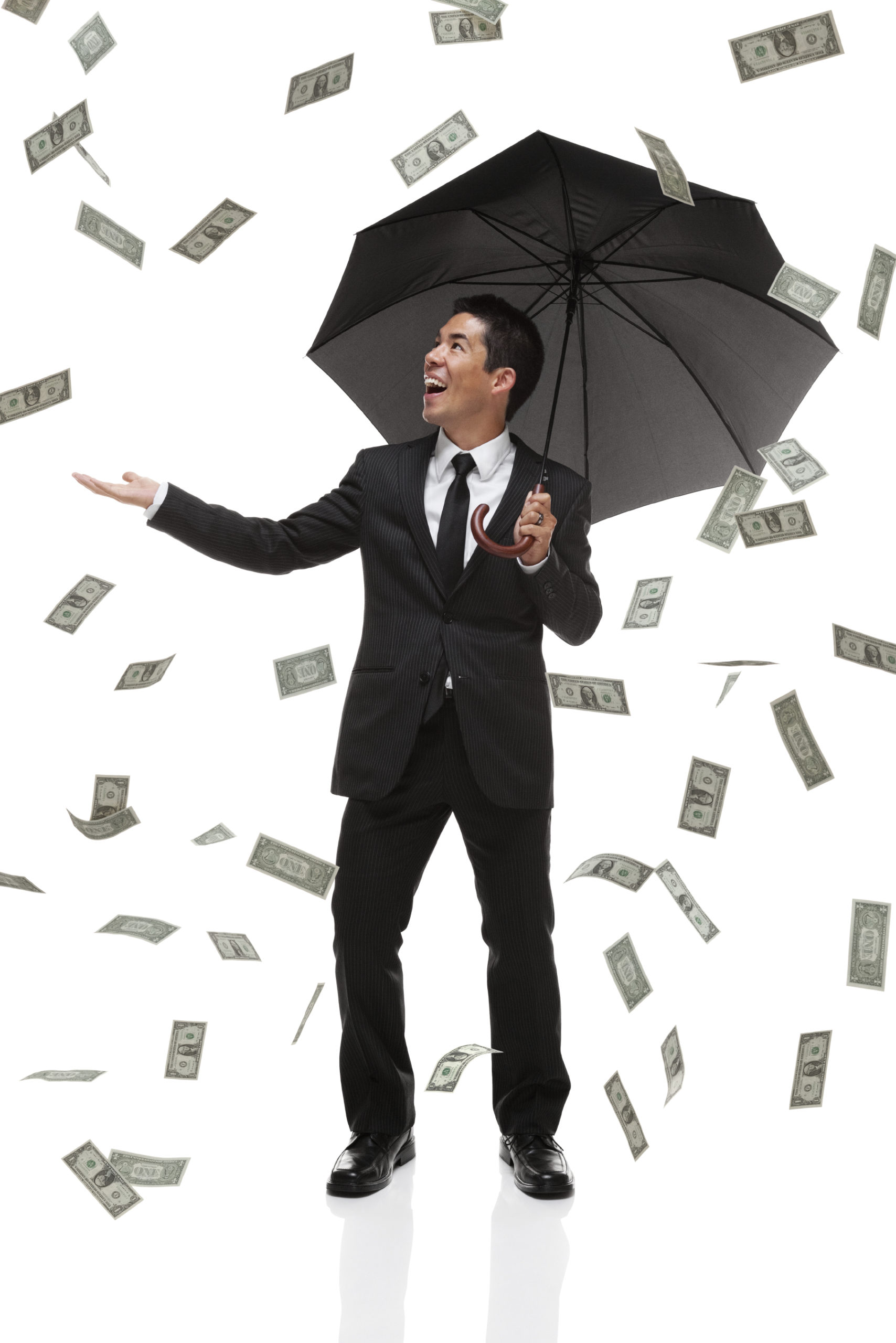 Raingin money on a buisiness man with an umbrella